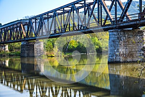 Steel railroad bridge by the river
