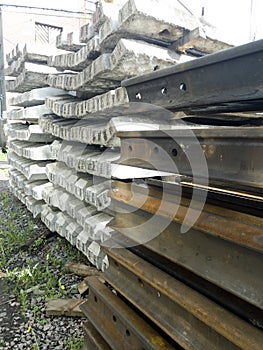 Steel rails and reinforced concrete sleepers prepared for assembly of finished railway tracks