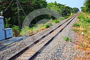 Steel rails are the routes of train travel.  In rural Thailand  Natural background