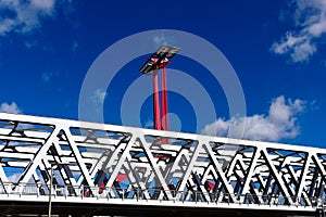 Steel railway bridge perspective closeup view. red steel post with solar panel