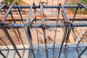 Steel rebar framing with hand wire are tying the beam steel for building