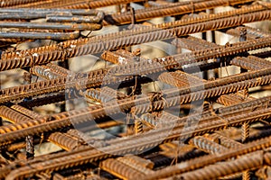 Steel rebar for reinforcement concrete at construction site with house under construction background,Industrial background.Rusty