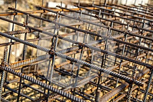 Steel rebar for reinforcement concrete at construction site with house under construction background,Industrial background.Rusty