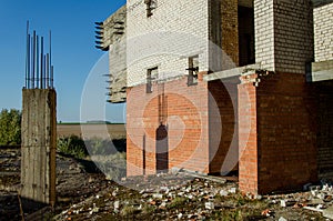 Steel reinforce in concrete column. Ruined old building