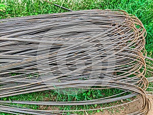 Steel rod for construction work on green grass