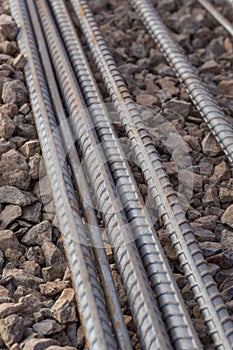 Steel rods or bars used to reinforce concrete