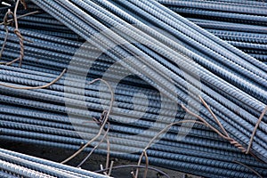 Steel rods or bars used to reinforce concrete.