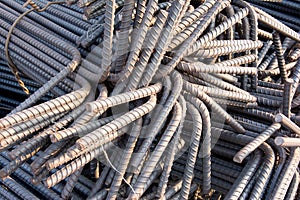 Steel rods or bars used to reinforce concrete.