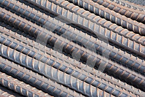 Steel rods or bars used to reinforce concrete.