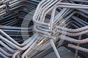 Steel rods or bars used to reinforce concrete.