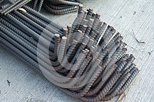 Steel rods or bars used to reinforce concrete.