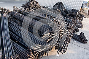 Steel rods or bars used to reinforce concrete.