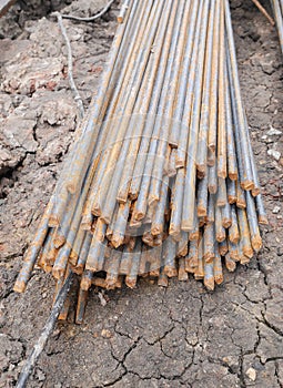 Steel rods or bars used to reinforce concrete in construction