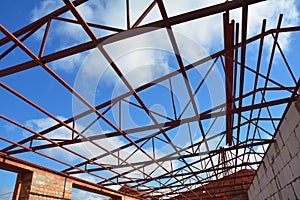 Steel roof trusses details with clouds sky background. Roof-trusses.