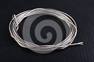 Steel rope coiled in a loop. Accessories in a home workshop