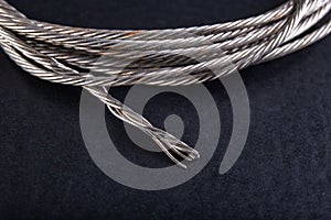 Steel rope coiled in a loop. Accessories in a home workshop