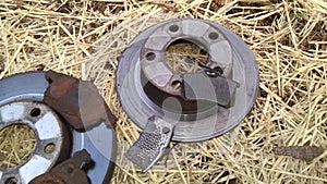 Brake rotors discs with pads. Some worn beyond normal tear and wear. photo