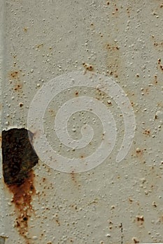 Steel rust and peeling paint.