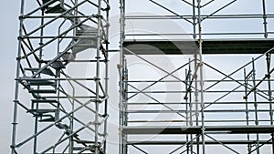 Steel scaffolding on cloudy sky