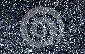 Steel scrap materials recycling. Abstract, background and texture of metal shavings. Aluminum chip waste after machining metal