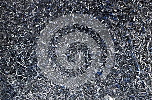 Steel scrap materials recycling. Abstract, background and texture of metal shavings.