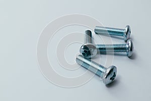 Steel screw. Screws on white background. Some metal machine screw bolts on white background