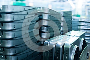 Steel sheets deposited in stacks in packs at the warehouse of metal products. Weathered metals sheet for construction