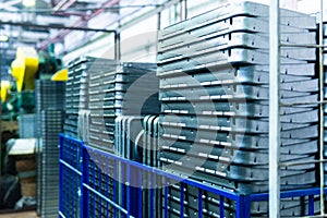 Steel sheets deposited in stacks in packs at the warehouse of metal products. Weathered metals sheet for construction