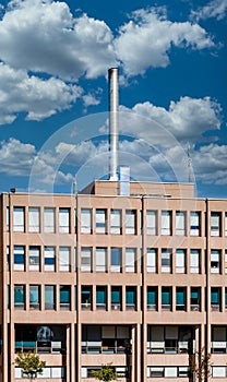 Steel Smokestack on Brown Building