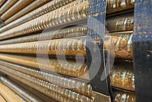 Steel, some round steel bars in the steel bearing outdoor, metal bundled with steel tape, selective focus photo