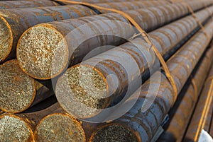 Steel, some round steel bars in the steel bearing outdoor, metal bundled with steel tape, selective focus photo