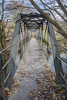 Steel span footbridge crossing a river