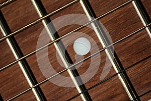 Steel strings and fretboard on classical guitar