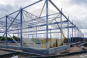 Steel structure framework building and stacks of sandwich panels for the facade covering