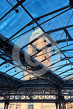 The steel structure of the glass roof and the clock tower in the old brewery