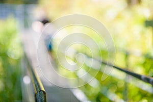 Steel suspension footbridge in mountains - image with natural extremely shallow depth of field