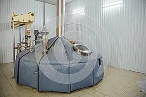 Steel tank for mash fermentation with sight glass in modern brewery. photo