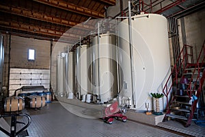 Steel tanks for first fermentation of grapes, Saint-Emilion wine making region picking, sorting with hands and crushing Merlot or