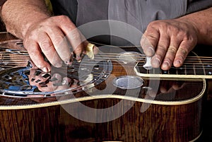Steel topped Dobro guitar is being played