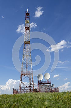 Steel tower of digital TV, cellular mobile communication repeater on the hill