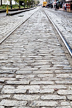 Steel Tracks in Cobblestone Street