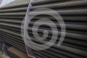 Steel tubes of the heat exchanger, the water heater in the boiler as background