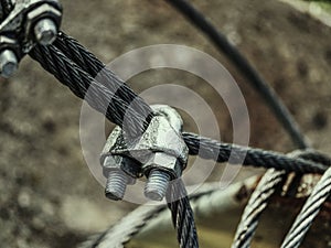 Steel turnbuckle and sling anchored safety net