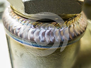 Steel weld joined pipe to plate by arc welding process. Weld