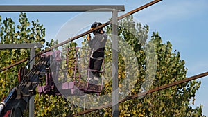 steel welder, worker welding steel on basket crane