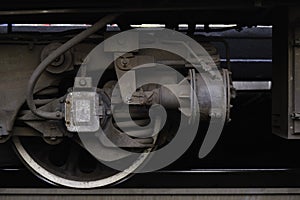 Steel wheel of a railcar on a rail with details, railway wheel