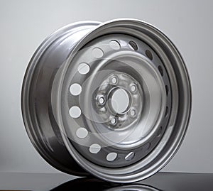 Steel wheel rim on grey background