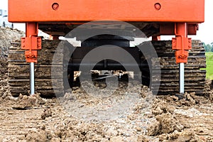 Steel Wheels backhoe braced ground.