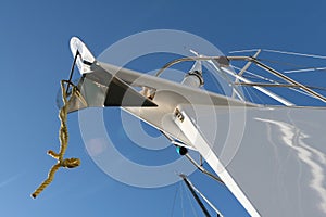 Steel white ship bow closeup over blue sky background