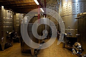 Steel wine vats in winery cellar